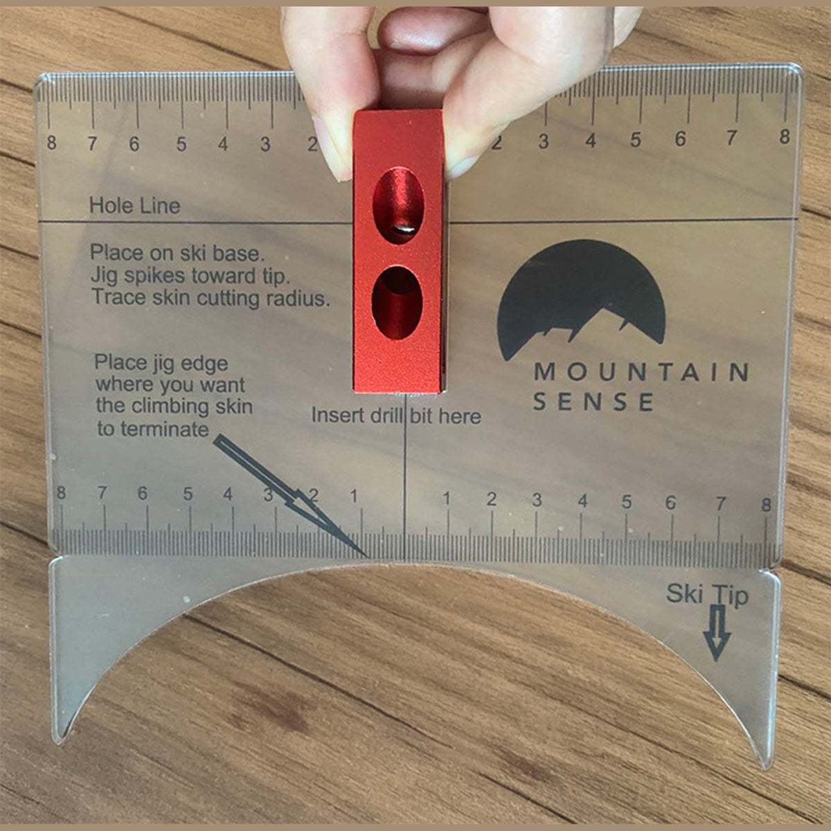 Mountain Sense acrylic hole guide jig with printed instructions for placing the Groovy Lock and skin cut radius