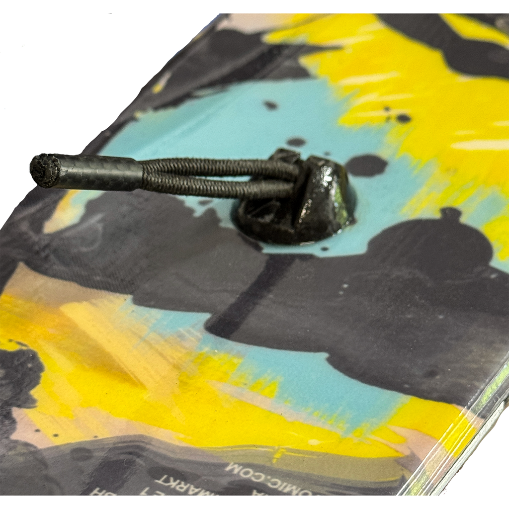 Close view of the Groovy Lock insert epoxied into a ski tail with the shockcord loop attached