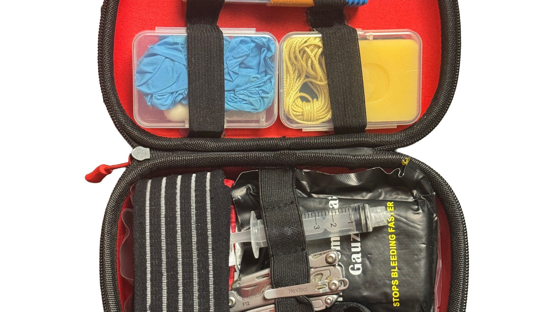 Backcountry Rescue Kit 2.0 open in its hard case, red lining packed with nitrile gloves, hemostatic gauze, multitool and ratchet