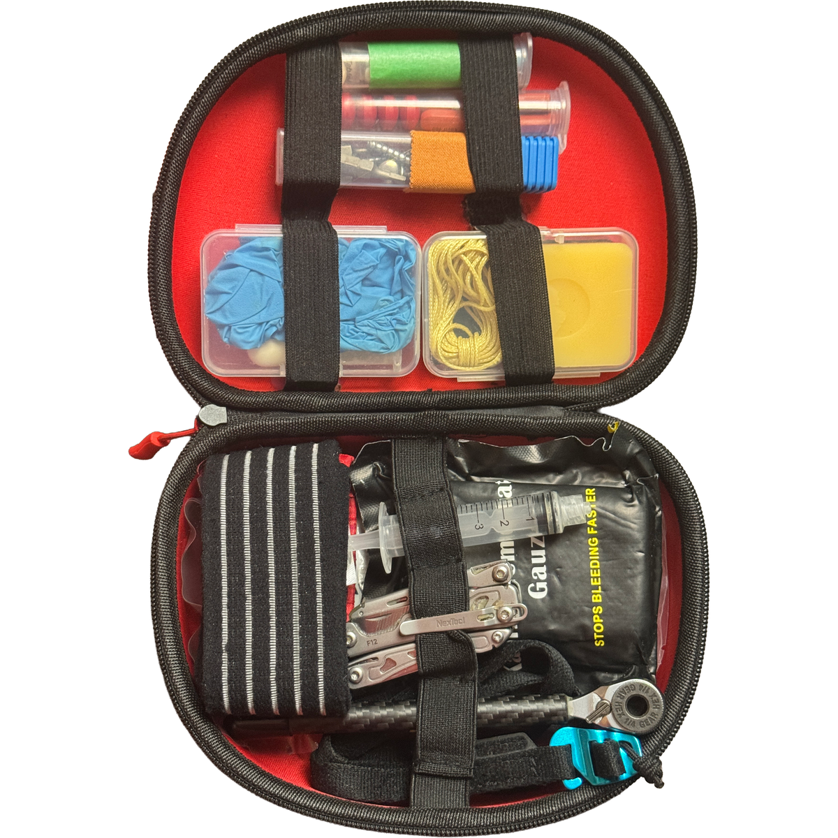 Backcountry Rescue Kit 2.0 open in its hard case, red lining packed with nitrile gloves, hemostatic gauze, multitool and ratchet