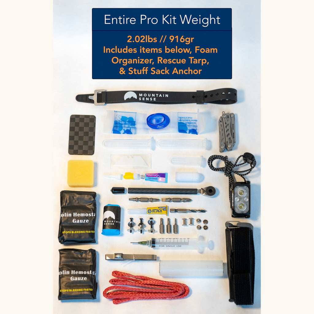 Every item in the Pro rescue kit laid out flat, total weight 2.02 lbs including foam organizer, rescue tarp and stuff sack anchor