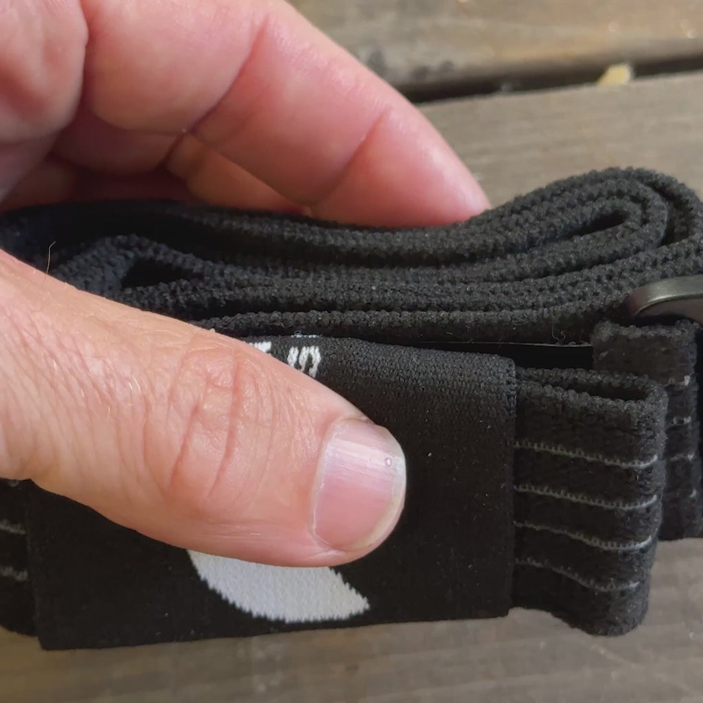 BW Belt Wrap rolled up in hand, showing its compact everyday-carry size