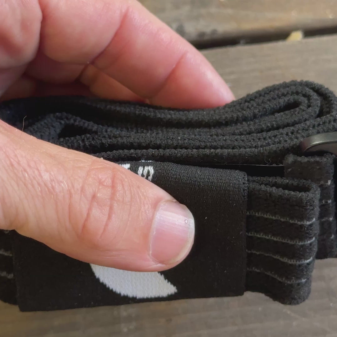 BW Belt Wrap rolled up in hand, showing its compact everyday-carry size