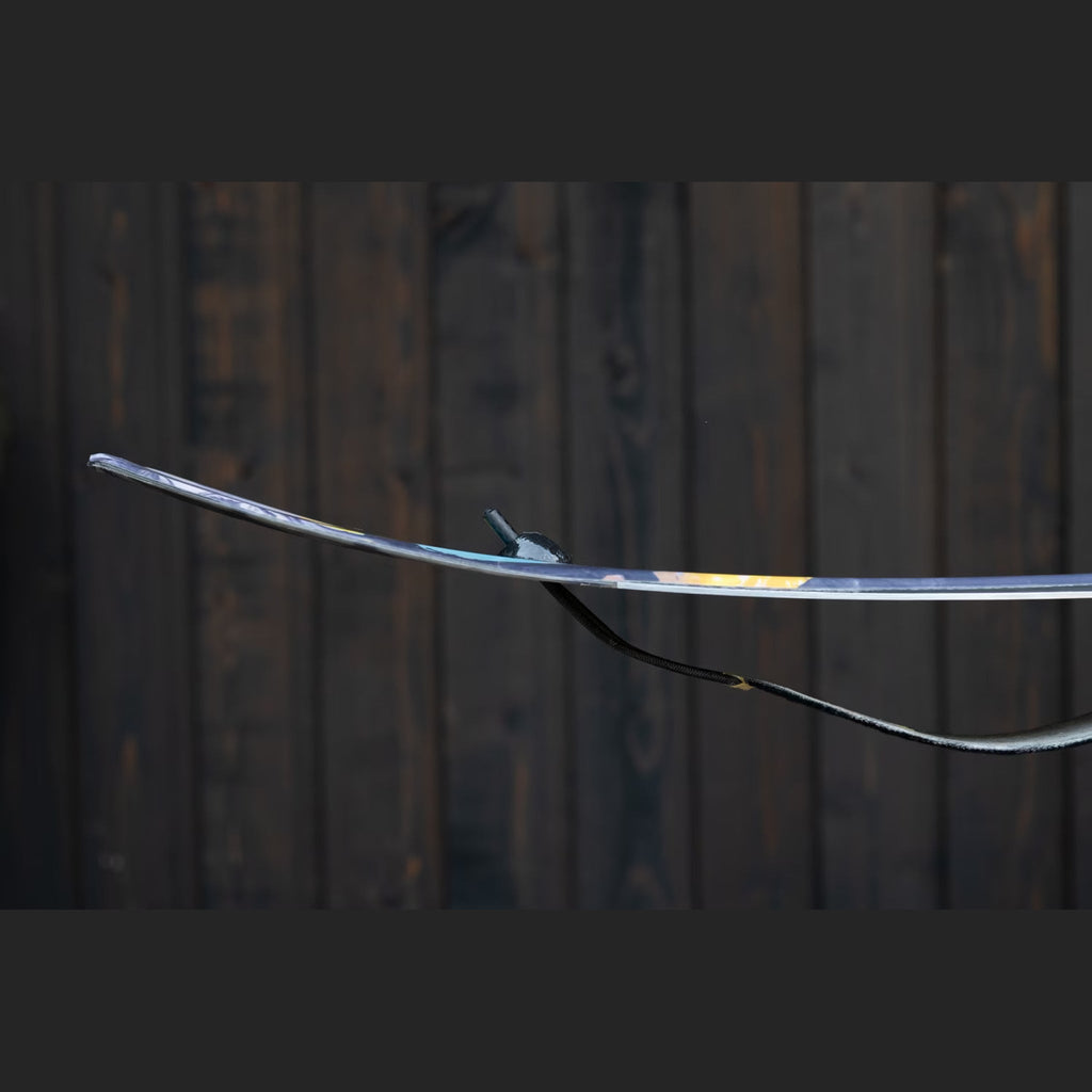 Profile view of a ski tail with the Groovy Lock insert holding a climbing skin flat against the base