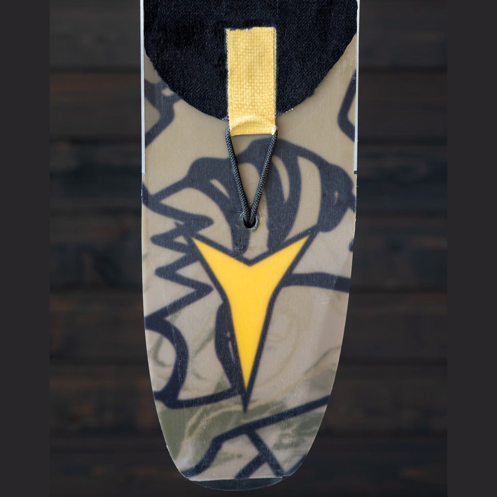 Groovy Lock bungee threaded through a ski tail and clipped to the aramid tail patch of a climbing skin